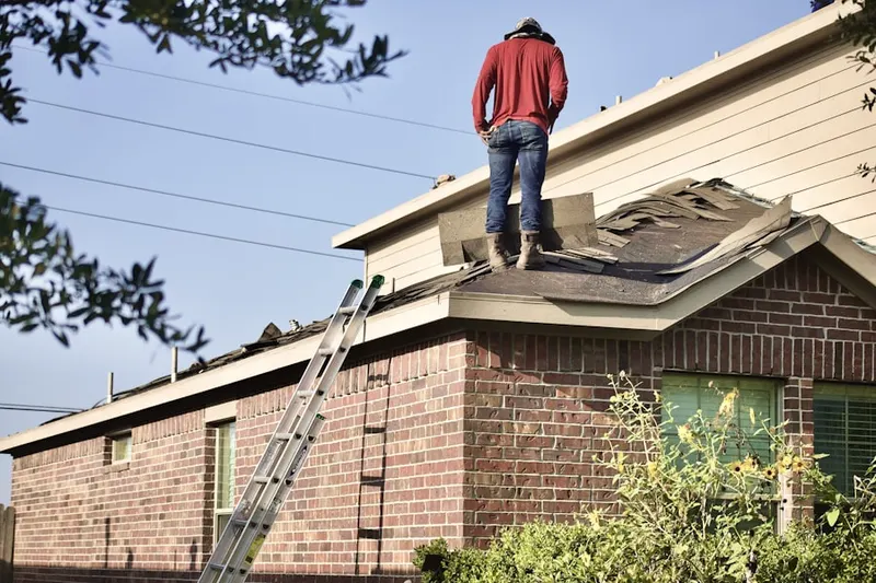 Professional roofer working on a residential roof in Judiciary Square